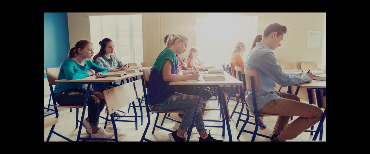 An image of students testing in a classroom. 